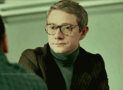 A Man Wearing Glasses And A Turtleneck Sweater GIF