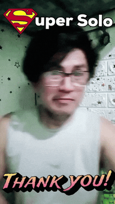 A Man Wearing Glasses And A White Tank Top Says " Thank You " GIF