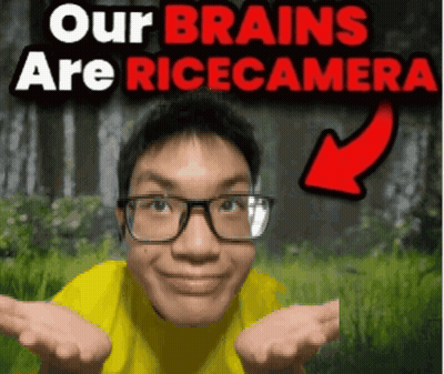 A Man Wearing Glasses And A Yellow Shirt With The Words " Our Brains Are Ricecamera " Behind Him GIF
