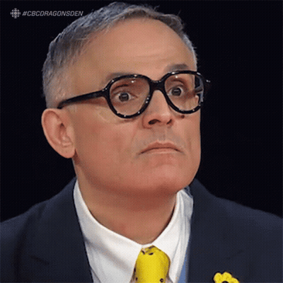 A Man Wearing Glasses And A Yellow Tie With The Hashtag #Cbcdragonsden On The Bottom GIF