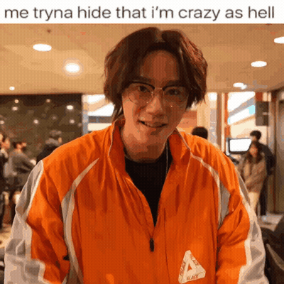 A Man Wearing Glasses And An Orange Jacket That Says Palace On It GIF