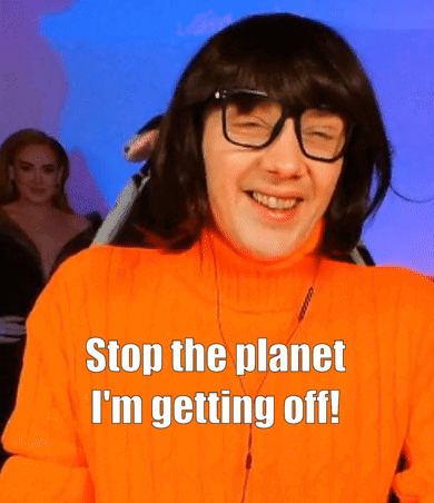 A Man Wearing Glasses And An Orange Sweater Says " Stop The Planet I 'M Getting Off ! " GIF