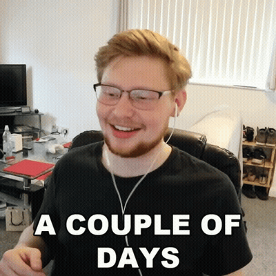 A Man Wearing Glasses And Ear Buds Is Smiling With The Caption A Couple Of Days GIF