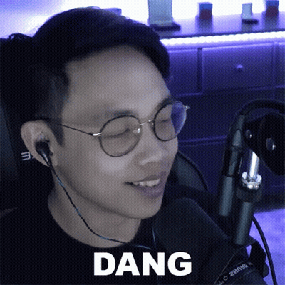 A Man Wearing Glasses And Ear Buds Says Dang GIF
