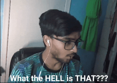 A Man Wearing Glasses And Earbuds Is Asking What The Hell Is That GIF