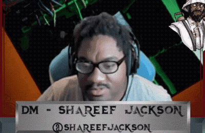 A Man Wearing Glasses And Headphones Behind A Sign That Says Shareef Jackson GIF