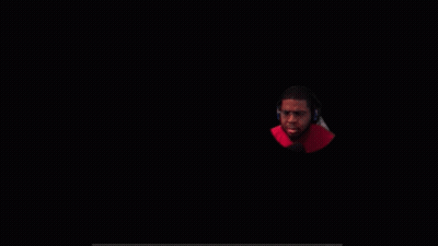 A Man Wearing Glasses And Headphones Is Looking At The Camera GIF