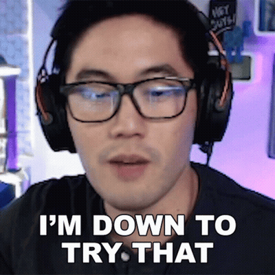 A Man Wearing Glasses And Headphones Is Saying I 'M Down To Try That GIF