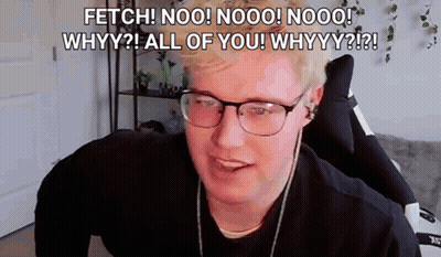 A Man Wearing Glasses And Headphones Is Sitting In A Chair And Talking To The Camera . GIF