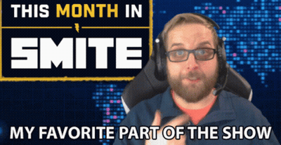 A Man Wearing Glasses And Headphones Is Sitting In Front Of A Sign That Says This Month In Smite GIF
