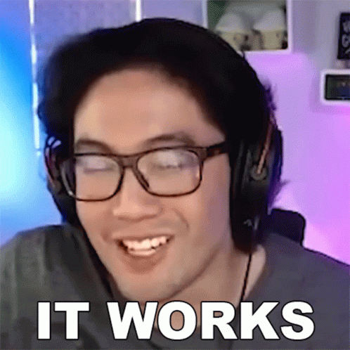 A Man Wearing Glasses And Headphones Is Smiling With The Words It Works Behind Him GIF