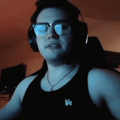 A Man Wearing Glasses And Headphones Is Wearing A Black Tank Top That Says Va On It GIF