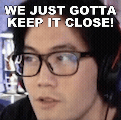 A Man Wearing Glasses And Headphones With The Words We Just Gotta Keep It Close Above Him GIF