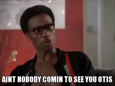 A Man Wearing Glasses And Suspenders Is Sitting On A Couch And Talking To Someone . GIF