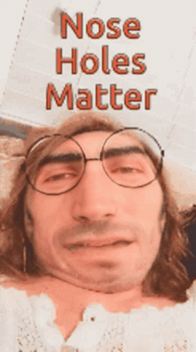 A Man Wearing Glasses Has The Words Nose Holes Matter Written Above Him GIF