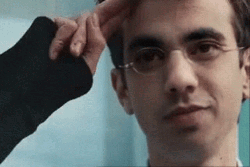 Man With Glasses Being Touched By Hand GIF