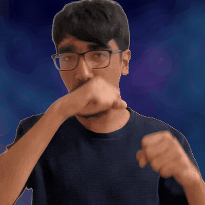 A Man Wearing Glasses Is Covering His Mouth With His Hand GIF