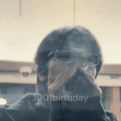 A Man Wearing Glasses Is Covering His Mouth With His Hand And The Words 1001 Birthday Are Visible In The Corner GIF