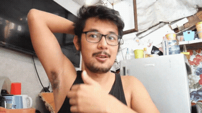 A Man Wearing Glasses Is Giving A Thumbs Up In Front Of A Fridge That Says ' Fresh ' On It GIF