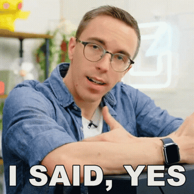 A Man Wearing Glasses Is Giving A Thumbs Up With The Words I Said Yes Below Him GIF