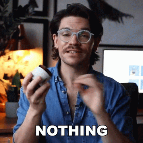 A Man Wearing Glasses Is Holding A Cup And Says " Nothing " In Front Of Him GIF