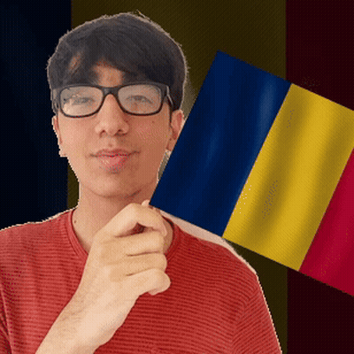A Man Wearing Glasses Is Holding A Flag In Front Of Him GIF