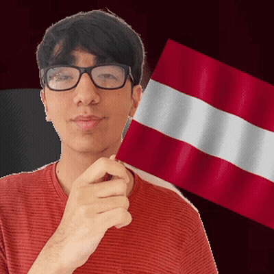 A Man Wearing Glasses Is Holding A Flag In Front Of His Face GIF
