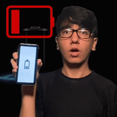 A Man Wearing Glasses Is Holding Up A Cell Phone With A Battery On The Screen GIF