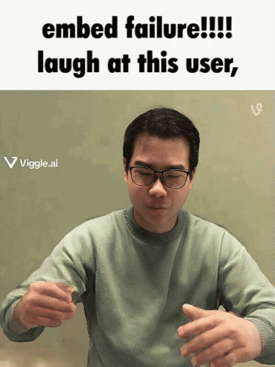 A Man Wearing Glasses Is Laughing At A Failed Embed GIF