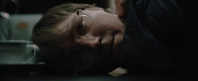 A Man Wearing Glasses Is Laying Down With His Eyes Closed GIF