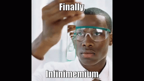 A Man Wearing Glasses Is Looking At A Test Tube With The Words Finally Infinimemium On It . GIF