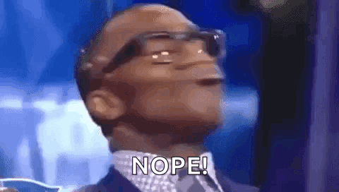 A Man Wearing Glasses Is Making A Funny Face And Saying Nope . GIF