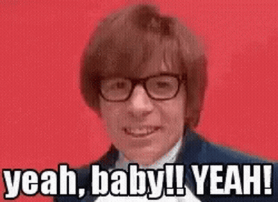A Man Wearing Glasses Is Making A Funny Face And Saying Yeah Baby ! Yeah ! GIF