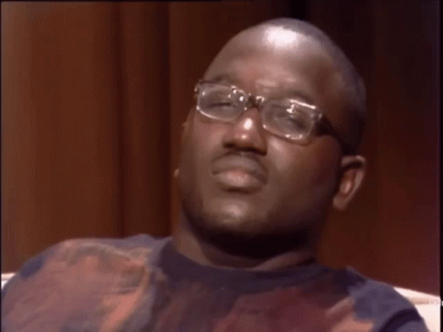 A Man Wearing Glasses Is Making A Funny Face And The Word Wack Is On His Face GIF