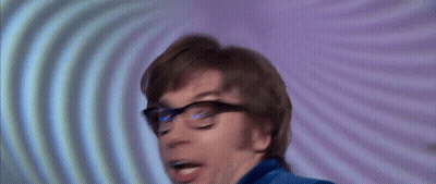 A Man Wearing Glasses Is Making A Funny Face GIF