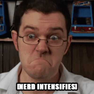 A Man Wearing Glasses Is Making A Funny Face With The Words Nerd Intensifies Written Above Him . GIF