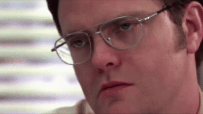 A Man Wearing Glasses Is Making A Sad Face . GIF