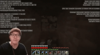 A Man Wearing Glasses Is Playing A Video Game On A Computer GIF