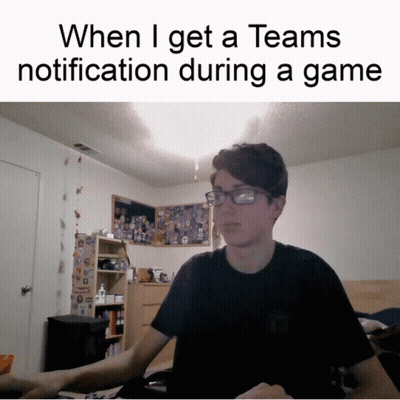 A Man Wearing Glasses Is Sitting At A Desk With A Caption That Says When I Get A Teams Notification GIF