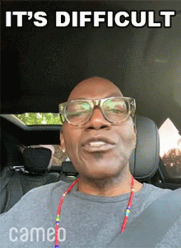 A Man Wearing Glasses Is Sitting In The Back Seat Of A Car With The Words It 'S Difficult Above Him GIF