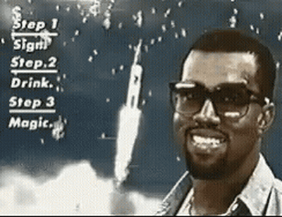 A Man Wearing Glasses Is Smiling In Front Of A Rocket Launching GIF