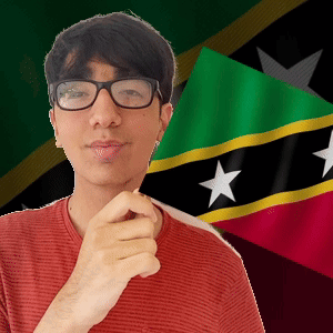 A Man Wearing Glasses Is Standing In Front Of A Flag With Stars On It GIF