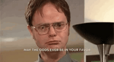 A Man Wearing Glasses Is Standing In Front Of A Lamp And A Lamp . GIF
