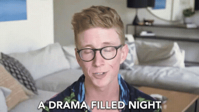 A Man Wearing Glasses Is Talking About A Drama Filled Night GIF