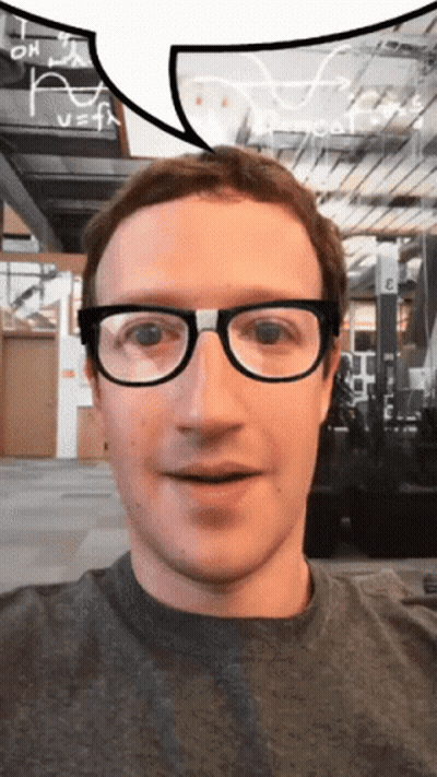 A Man Wearing Glasses Looks At The Camera With A Speech Bubble Above His Head GIF
