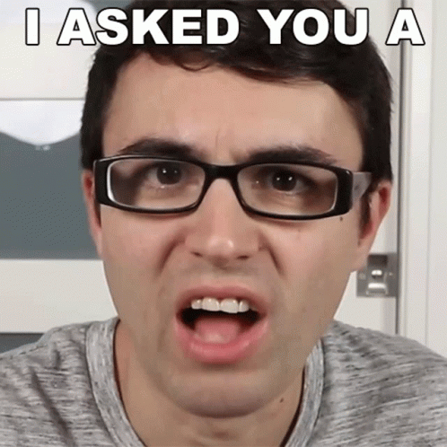 A Man Wearing Glasses Making A Funny Face With The Words I Asked You A GIF