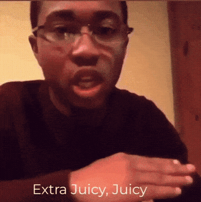 A Man Wearing Glasses Says Extra Juicy Juicy In Front Of His Face GIF