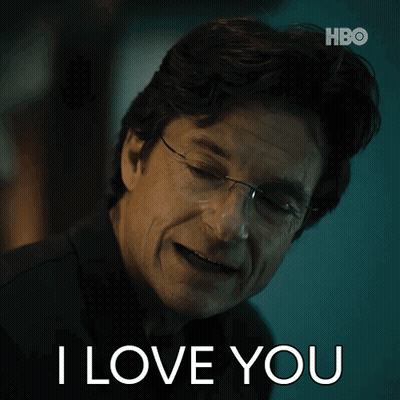 A Man Wearing Glasses Says " I Love You " In Front Of A Hbo Logo GIF