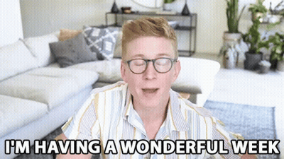 A Man Wearing Glasses Says I 'M Having A Wonderful Week In A Living Room GIF