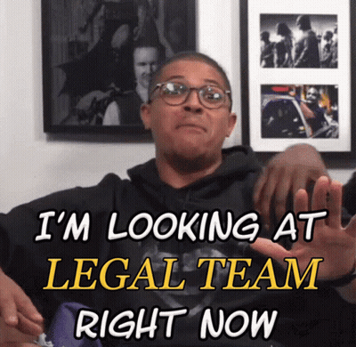 A Man Wearing Glasses Says I 'M Looking At Legal Team Right Now In Yellow Letters GIF